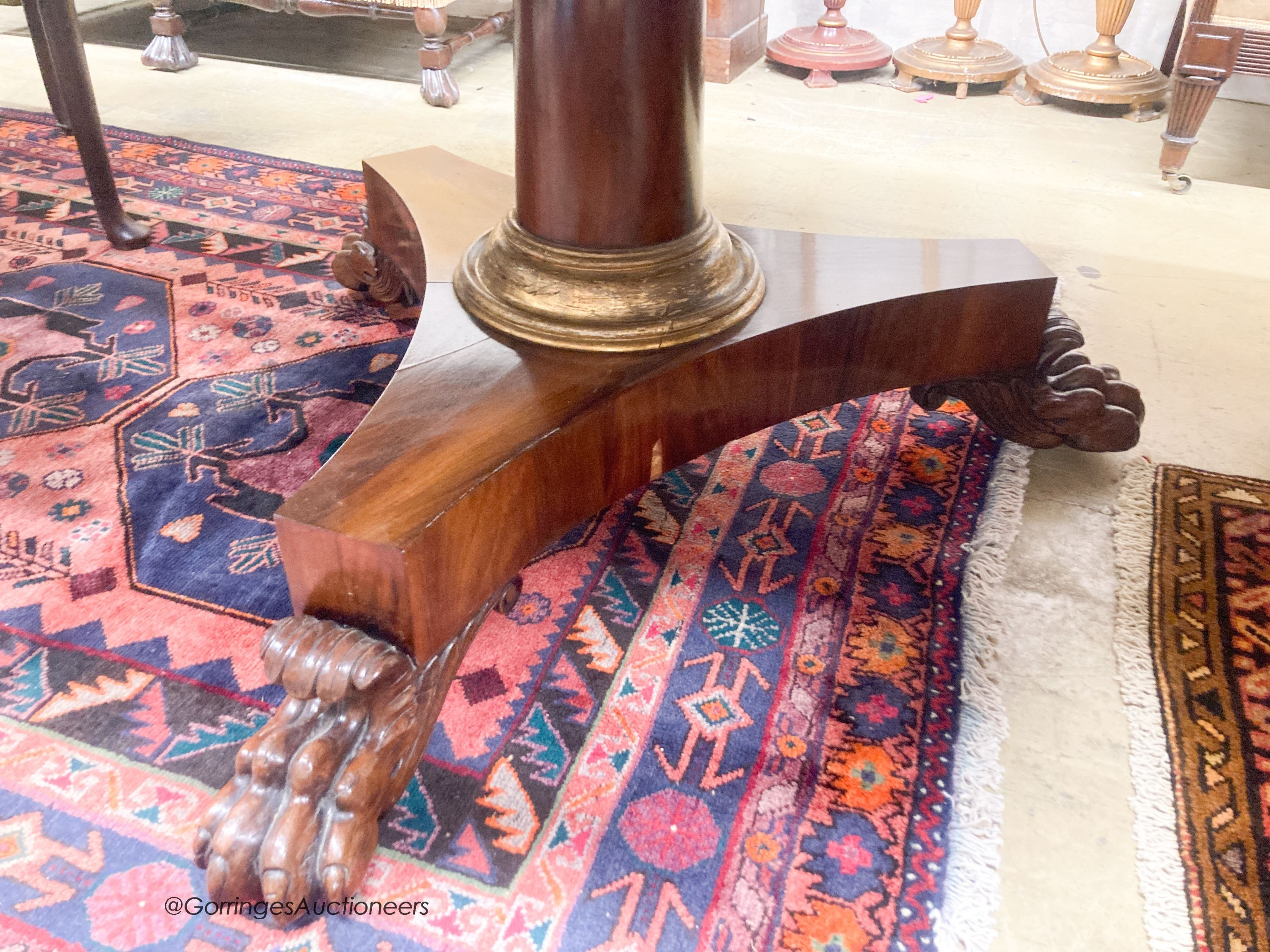 A George IV and later mahogany and satinwood circular tilt top breakfast table, diameter 138cm, height 76cm